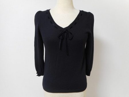 これぞシックの極みのブラックニット。組曲のエレガントなリボンニットを買取しました