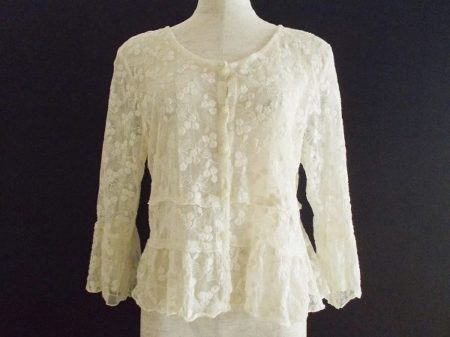 繊細なレースでできたバラ色の暮しのカーディガンを買い取りました